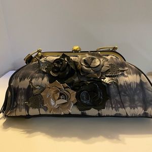 Sharif Couture leather bag with black gray and gold leather flowers on front.